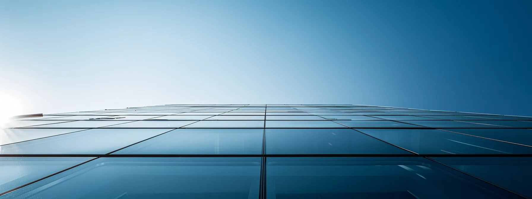 a panoramic view of a sleek, modern commercial building with a stylish flat roof, showcasing solar panels glistening in the sunlight against a clear blue sky, highlighting its energy efficiency and contemporary aesthetic.