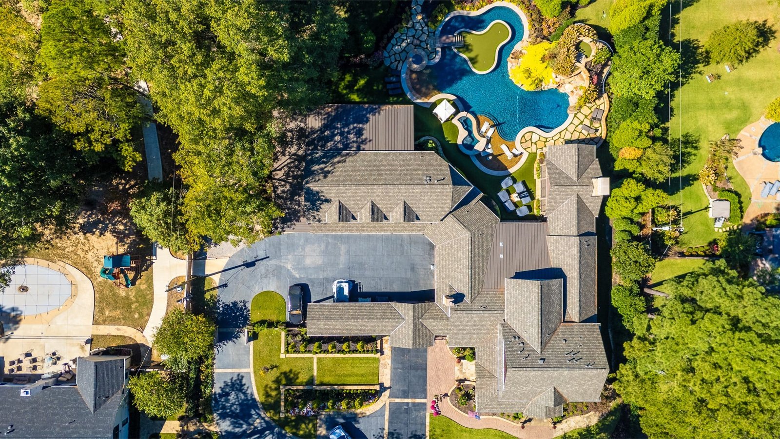 Aerial view of a home with a backyard pool.